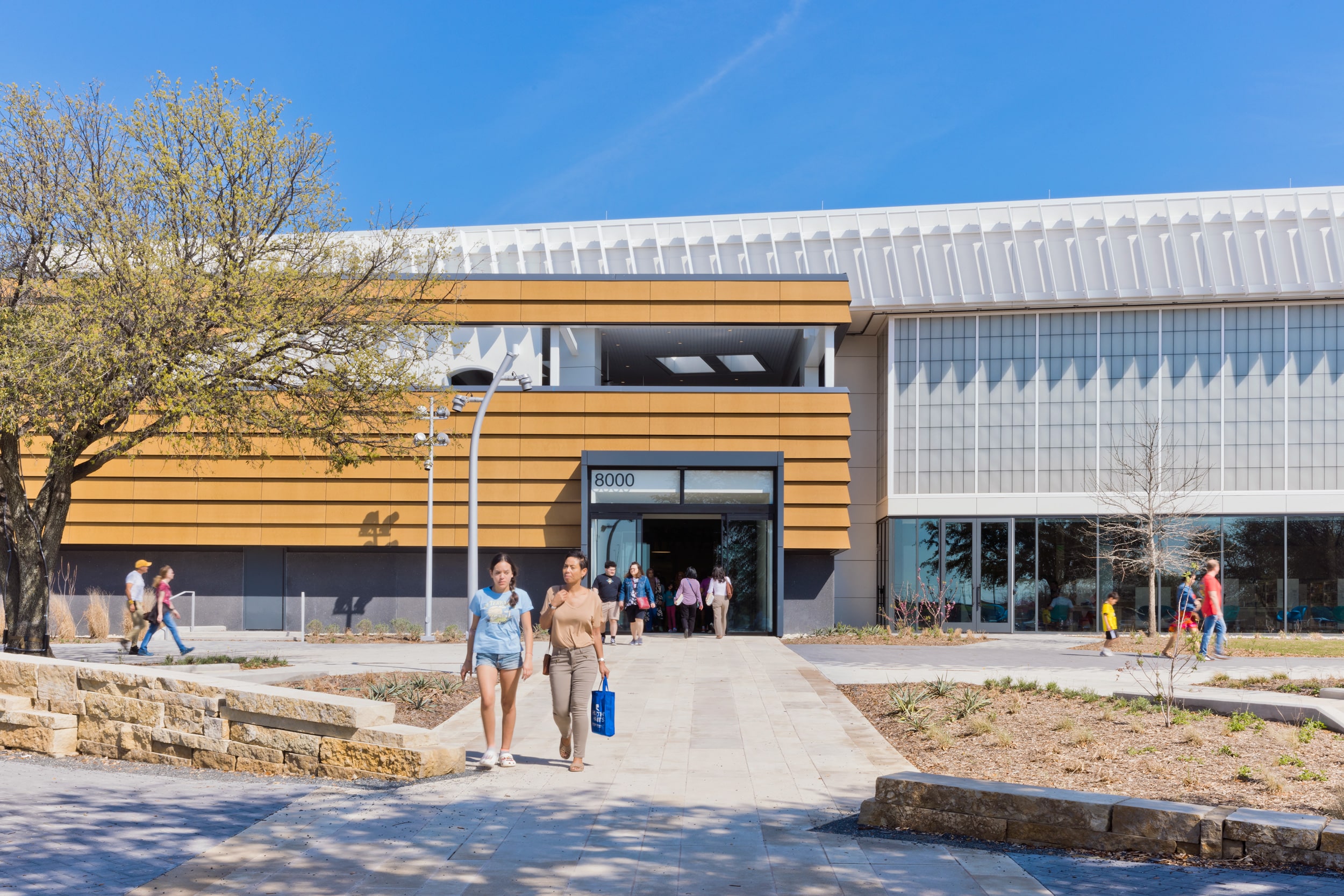 The Frisco Public Library by GENSLER incorporates maintenance-free Parklex Prodema panels in a Mustard hue.