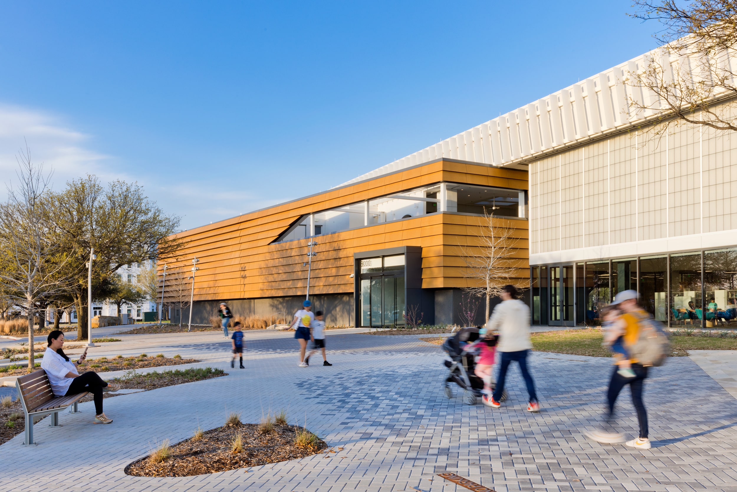 Custom-made cladding panels create an overlapping cladding system that gives character to the 12,000-square-foot façade, while paying tribute to vernacular architecture.